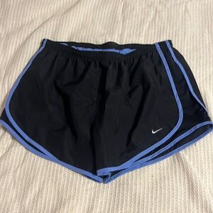 Black and blue trimmed mike athletic shorts.